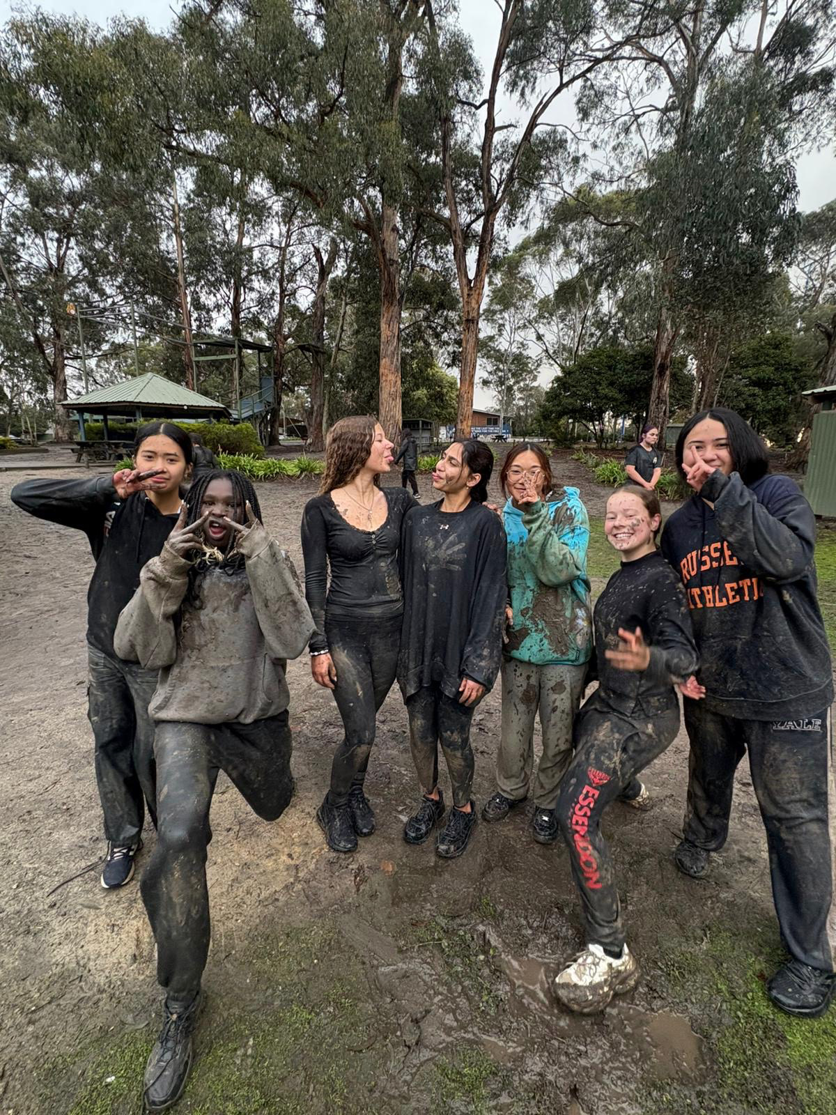 Youth group covered in mud after a challenge at The Summit, Gippsland